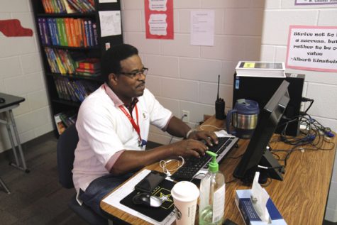 Kenneth Williams, types on his computer. 